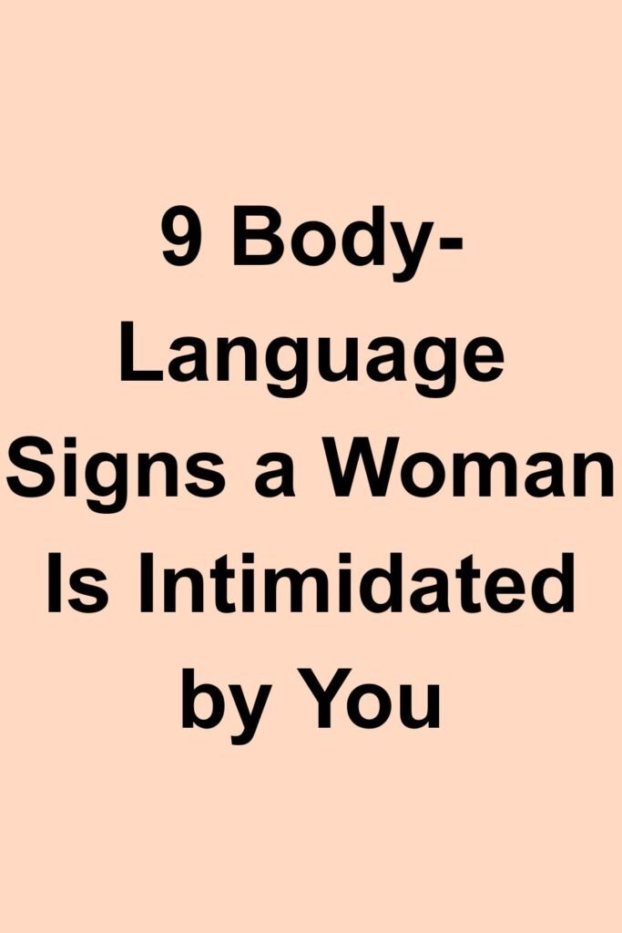 Text-only cover with the title “9 Body-Language Signs a Woman Is Intimidated by You” on a peach background.