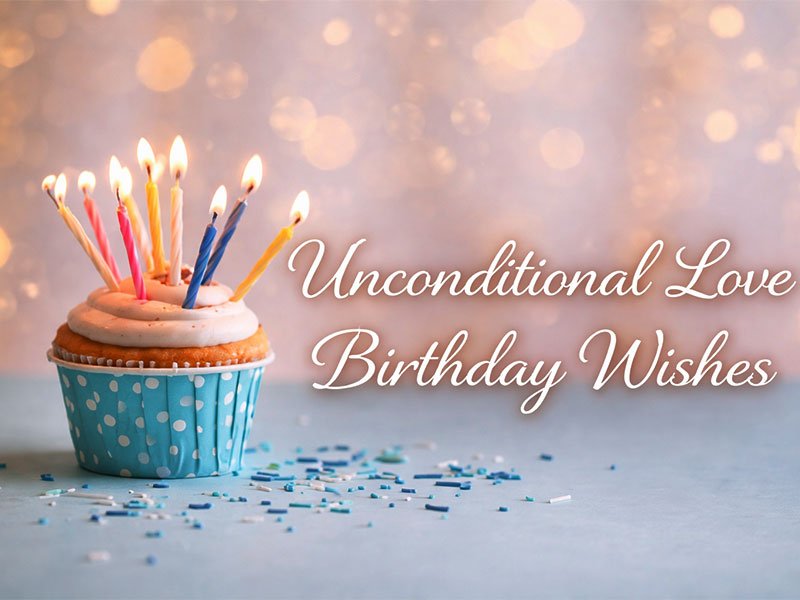 Unconditional love birthday wishes text with a cupcake topped with lit candles and sprinkles on a soft, pastel background.
