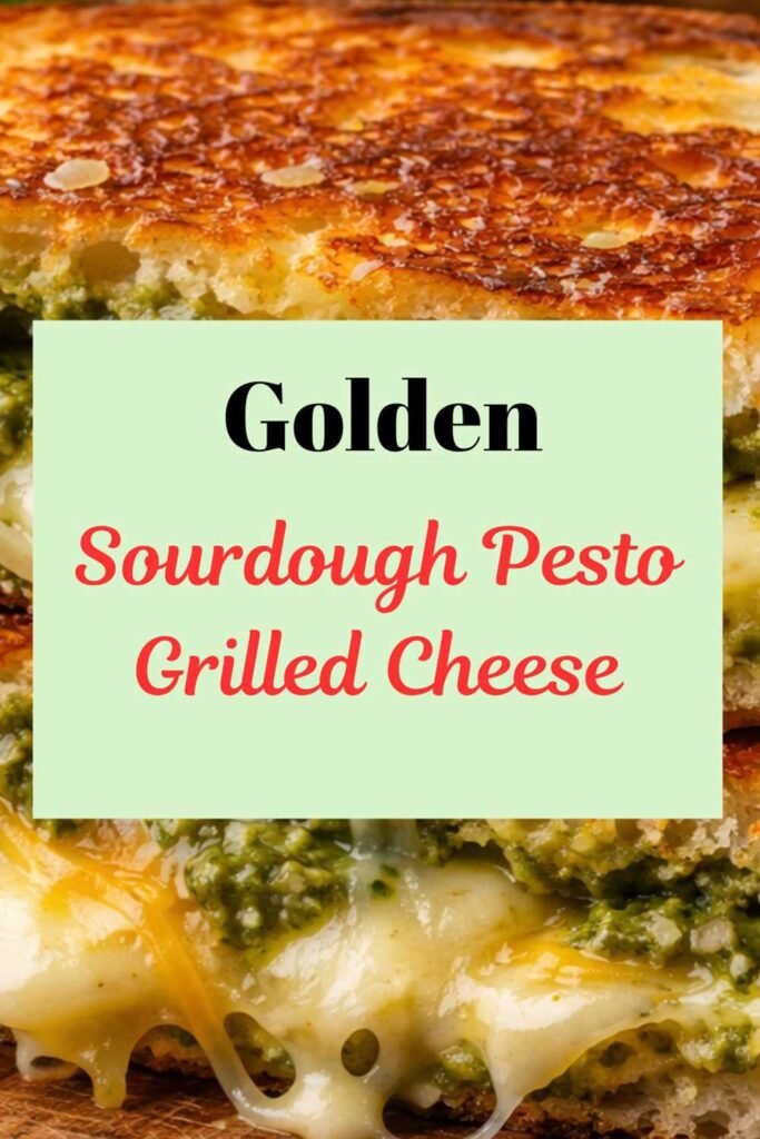 Golden sourdough pesto grilled cheese sandwich with crispy buttered bread, melted mozzarella and cheddar, and vibrant basil pesto filling