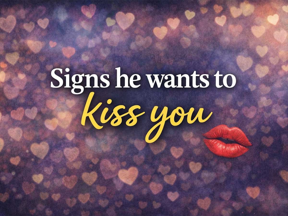 Text that says “Signs he wants to kiss you” on a heart bokeh background with red lips icon.