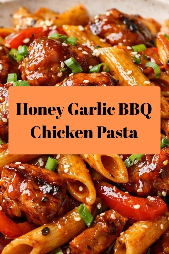 Sticky honey garlic BBQ chicken pasta with glazed chicken, penne, bell peppers, and green onion garnish.