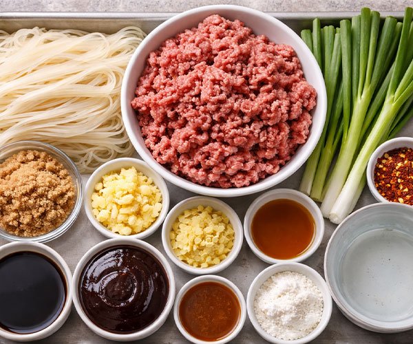 Ingredients for Mongolian ground beef noodles arranged neatly on a tray.